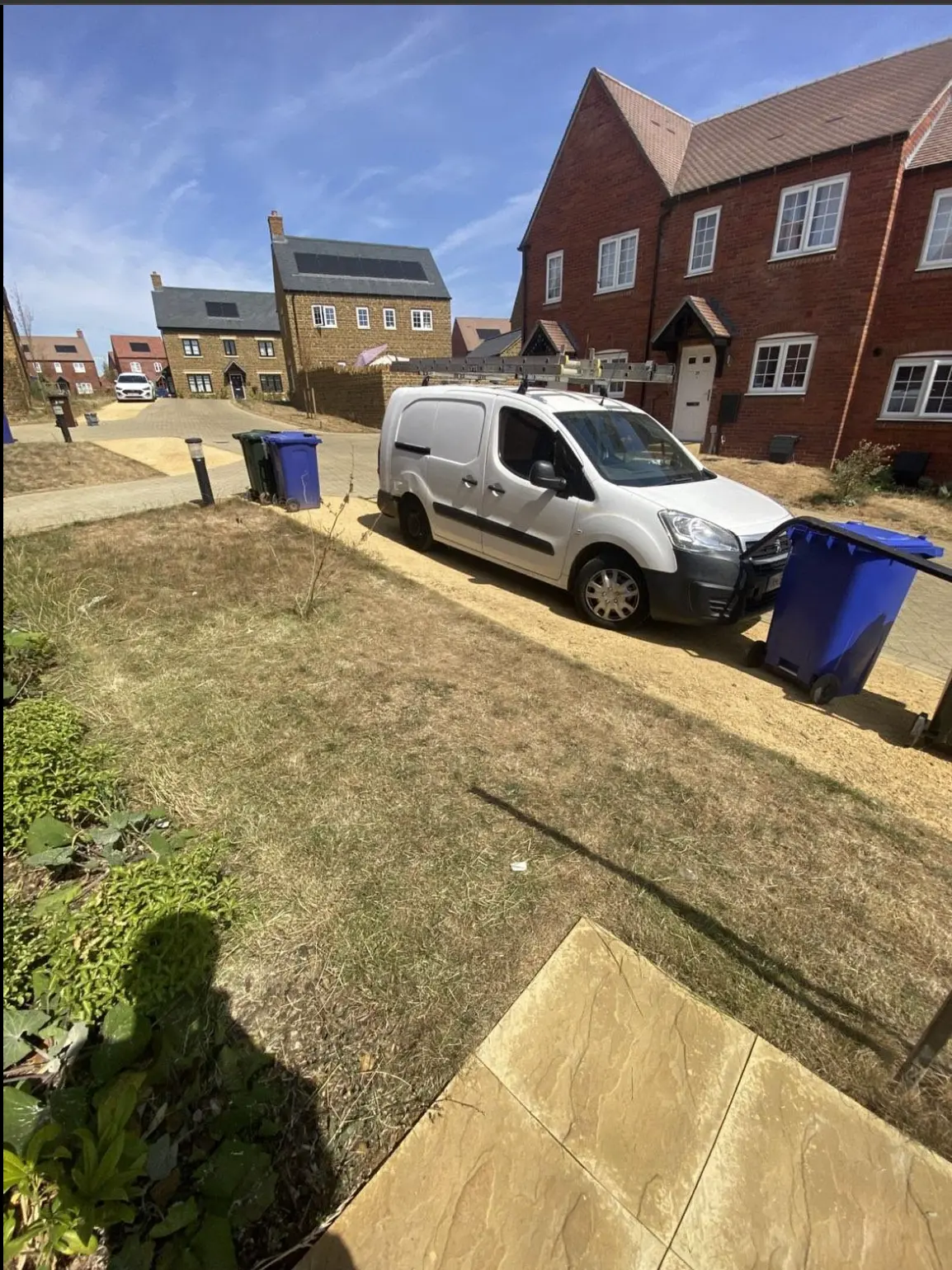 C&B Garden Landscaping work van parked on a gravel driveway
